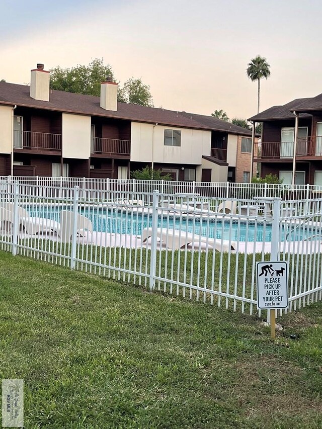4601 S Carmen Ave Unit 2603, Rancho Viejo, TX 78575 - view of pool at dusk