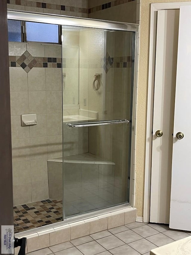 4601 S Carmen Ave Unit 2603, Rancho Viejo, TX 78575 - bathroom featuring tile patterned floors and a shower with door