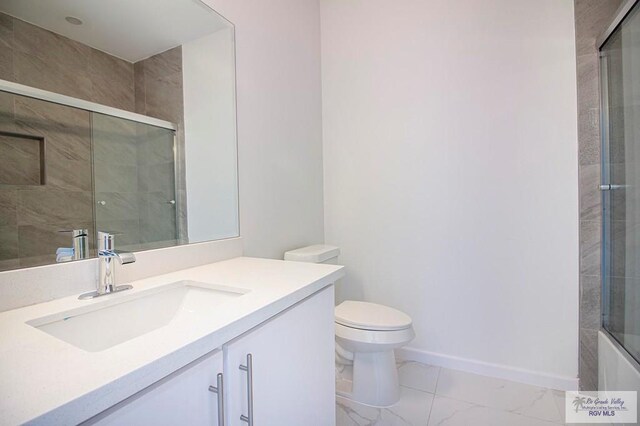 full bathroom featuring combined bath / shower with glass door, vanity, and toilet