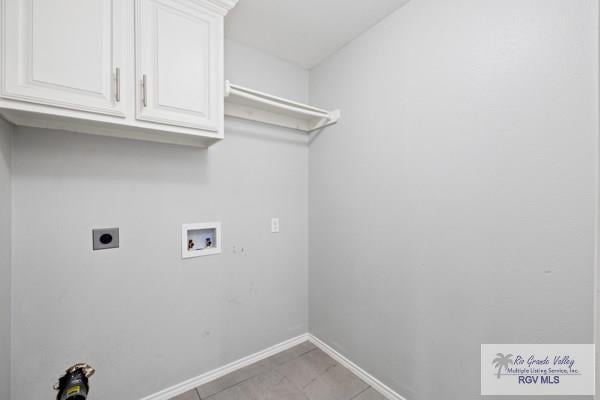 laundry area featuring washer hookup, cabinet space, electric dryer hookup, and baseboards