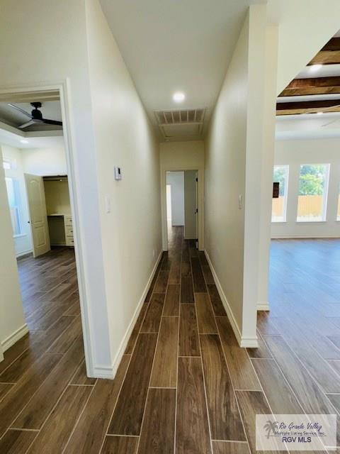 16602 Napper Ln, Primera, TX 78552 - hall featuring dark wood-style flooring, baseboards, and beam ceiling