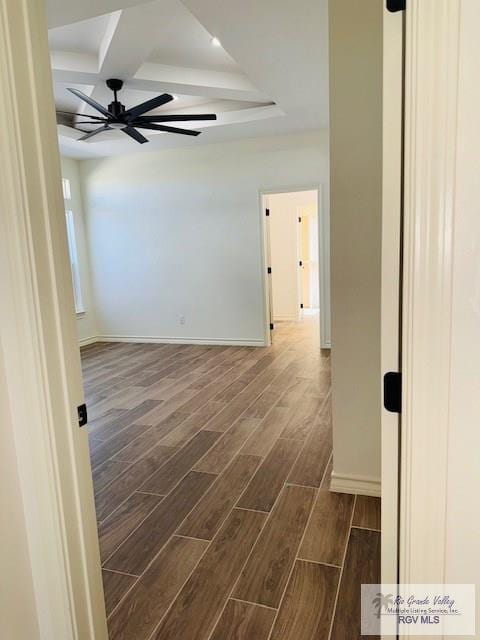 16602 Napper Ln, Primera, TX 78552 - unfurnished room with dark wood finished floors, coffered ceiling, beamed ceiling, a ceiling fan, and baseboards