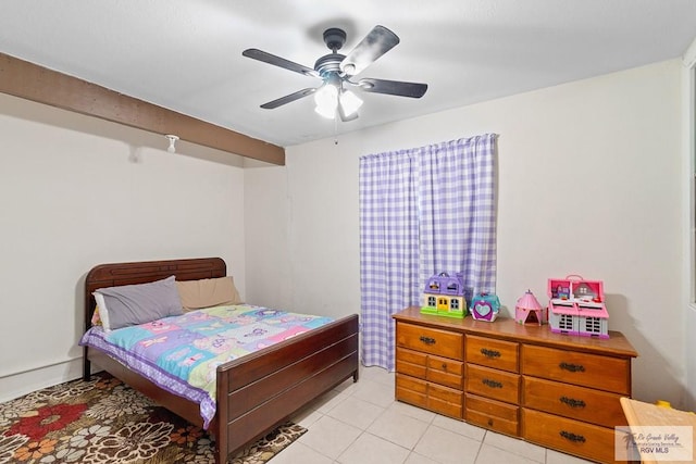 tiled bedroom featuring ceiling fan