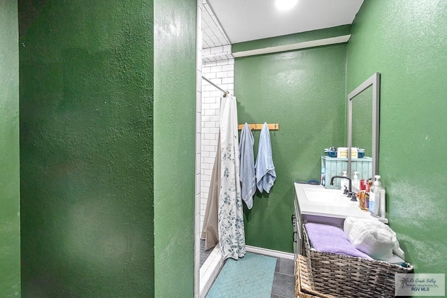 bathroom with a shower with curtain, tile patterned flooring, and vanity