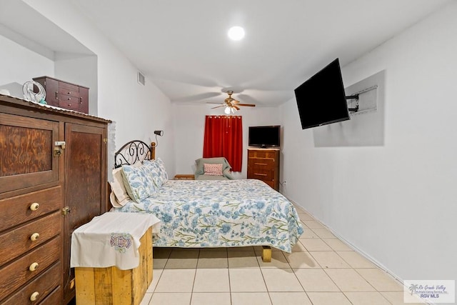 bedroom with ceiling fan and light tile patterned floors