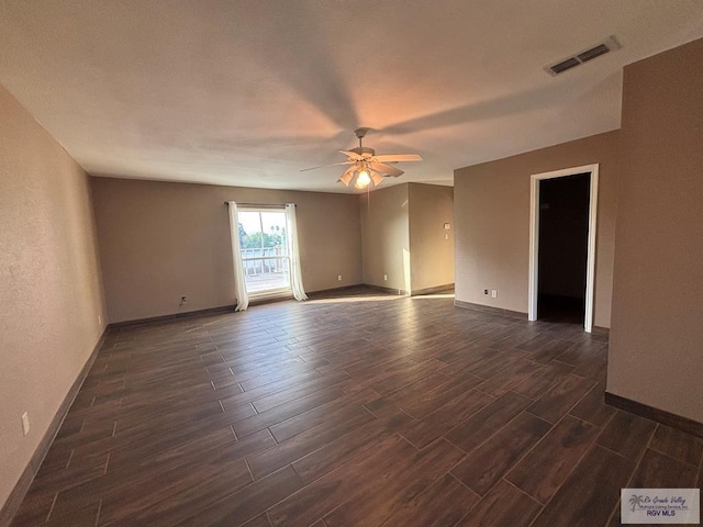 1060 Timothy St, San Benito, TX 78586 - spare room featuring wood finish floors, visible vents, baseboards, and ceiling fan