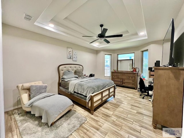 3706 Bea Ave, Harlingen, TX 78552 - bedroom with a raised ceiling, light wood-style flooring, ceiling fan, an office area, and baseboards