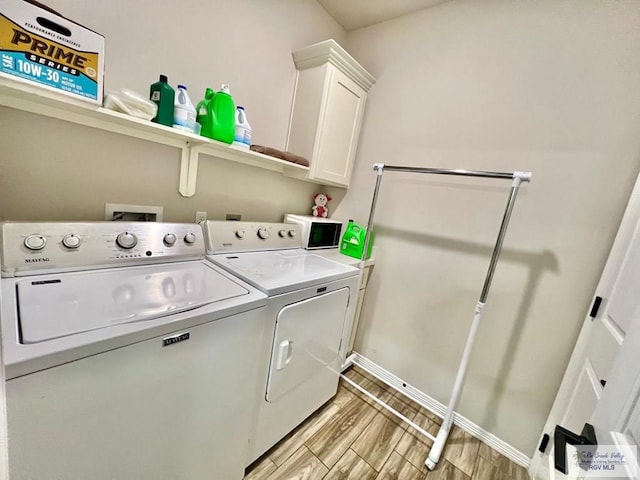 3706 Bea Ave, Harlingen, TX 78552 - laundry area with cabinet space, independent washer and dryer, baseboards, and light wood-style floors