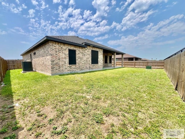 3706 Bea Ave, Harlingen, TX 78552 - rear view of property with brick siding and central AC unit