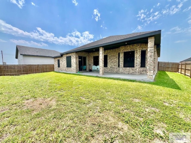 3706 Bea Ave, Harlingen, TX 78552 - rear view of house featuring a patio area and brick siding