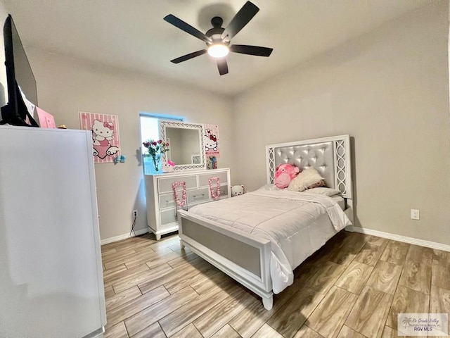 3706 Bea Ave, Harlingen, TX 78552 - bedroom with light wood-type flooring, baseboards, and ceiling fan