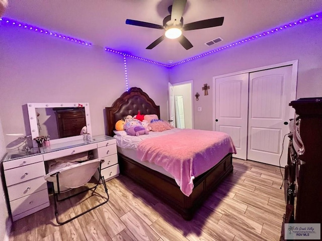 3706 Bea Ave, Harlingen, TX 78552 - bedroom featuring light wood-style floors, a closet, a desk, and a ceiling fan