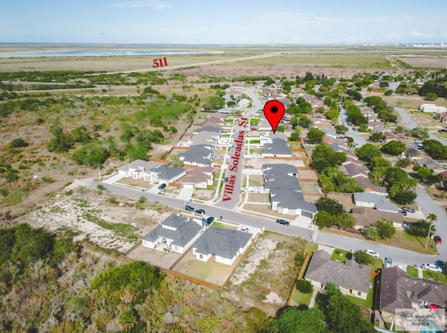 aerial view featuring a residential view and a water view