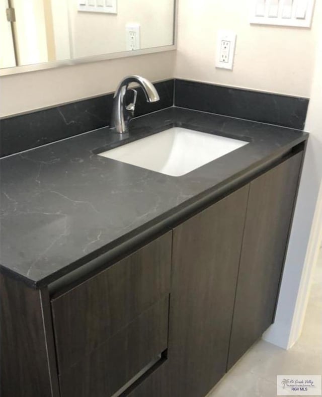 bathroom featuring tile patterned floors and vanity