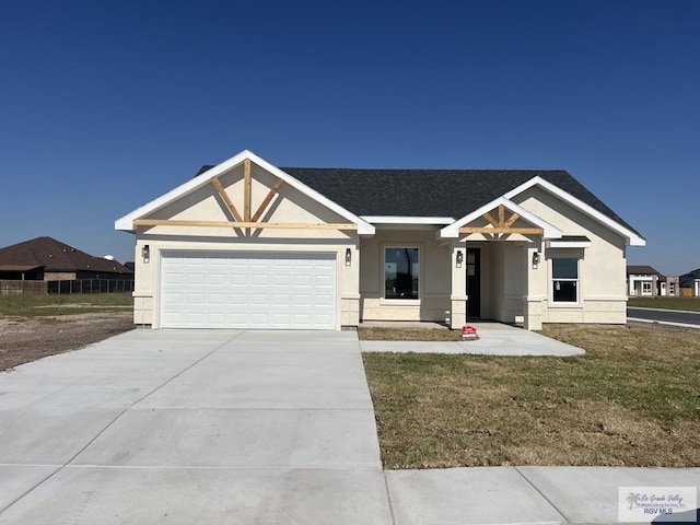 view of front facade with a front lawn and a garage