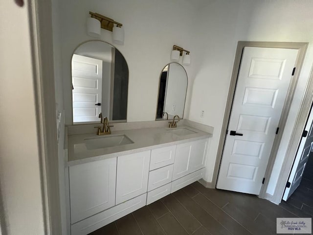 bathroom featuring hardwood / wood-style flooring and vanity