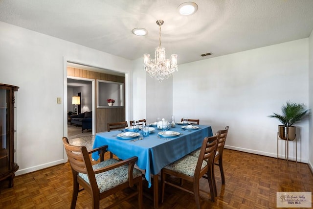 7969 Fm 2099, Lyford, TX 78580 - dining space featuring a chandelier and baseboards