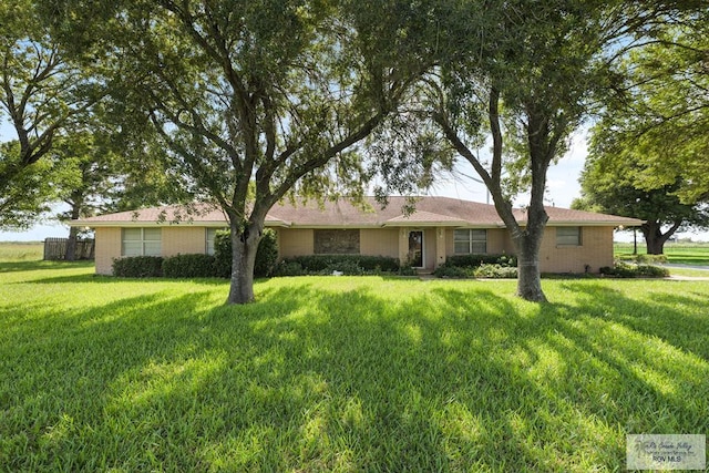 7969 Fm 2099, Lyford, TX 78580 - ranch-style home with a front yard