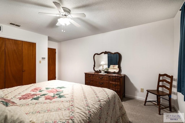 7969 Fm 2099, Lyford, TX 78580 - carpeted bedroom with a textured ceiling and ceiling fan