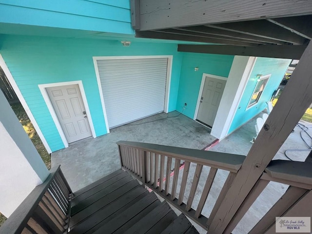 staircase with concrete flooring