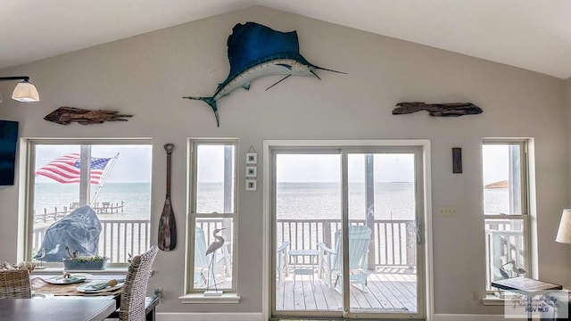 entryway featuring a water view and lofted ceiling