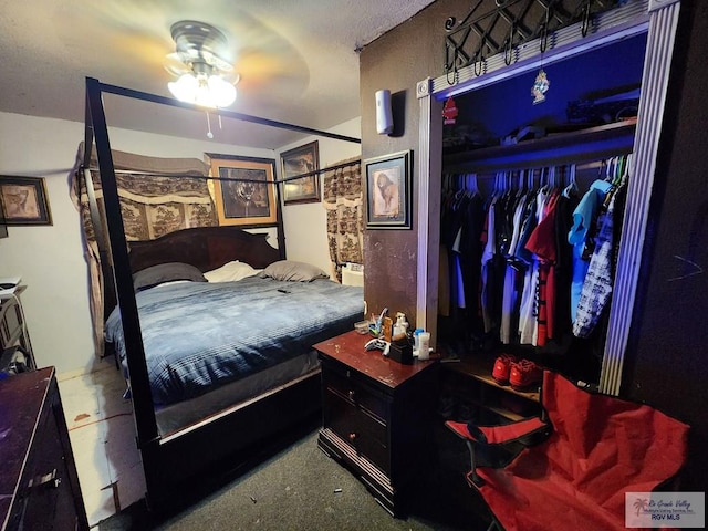 bedroom featuring ceiling fan and a closet