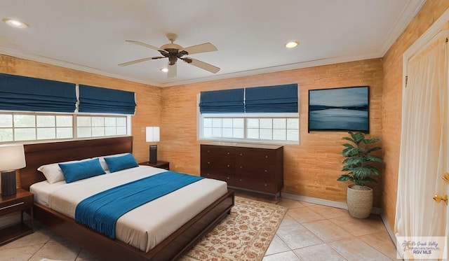 bedroom with light tile patterned floors, ornamental molding, and ceiling fan