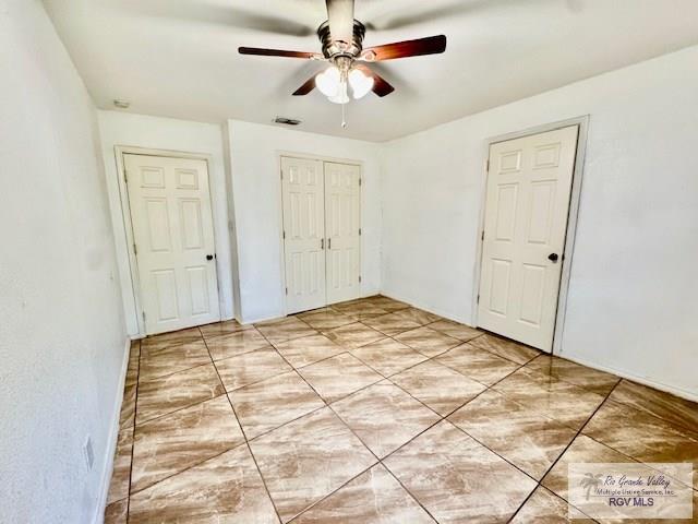 2413 Eastern Blvd, Brownsville, TX 78520 - unfurnished bedroom featuring a closet and ceiling fan