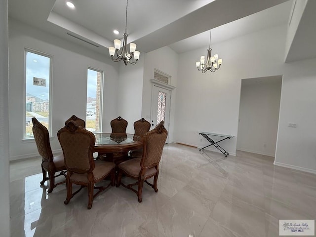 139 Heron Dr, Los Fresnos, TX 78566 - dining room with a chandelier, recessed lighting, and a raised ceiling