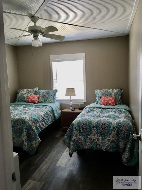 bedroom featuring hardwood / wood-style flooring and ceiling fan