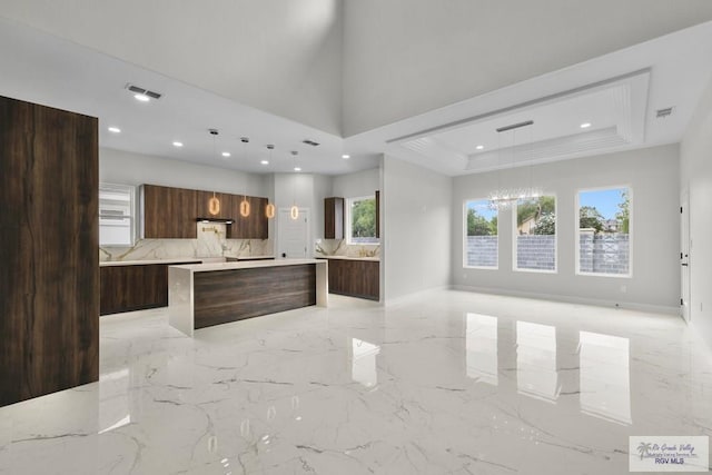 1013 Butler St, Edinburg, TX 78541 - kitchen featuring modern cabinets, a spacious island, dark brown cabinets, a chandelier, and recessed lighting