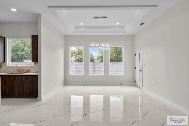 1013 Butler St, Edinburg, TX 78541 - unfurnished living room with a sink, light marble finish floors, plenty of natural light, a chandelier, and recessed lighting