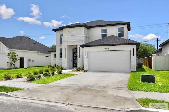 1013 Butler St, Edinburg, TX 78541 - view of front of house with an attached garage, stucco siding, driveway, and a shingled roof