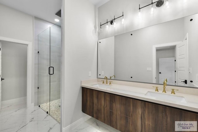1013 Butler St, Edinburg, TX 78541 - bathroom with marble finish flooring, a stall shower, baseboards, and double vanity