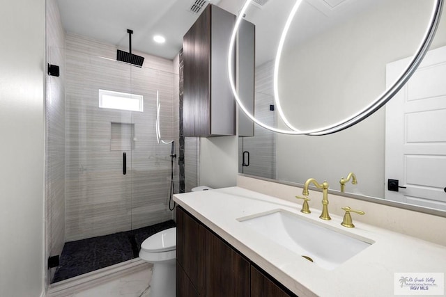 1013 Butler St, Edinburg, TX 78541 - full bathroom featuring marble look tile flooring, a stall shower, toilet, vanity, and recessed lighting