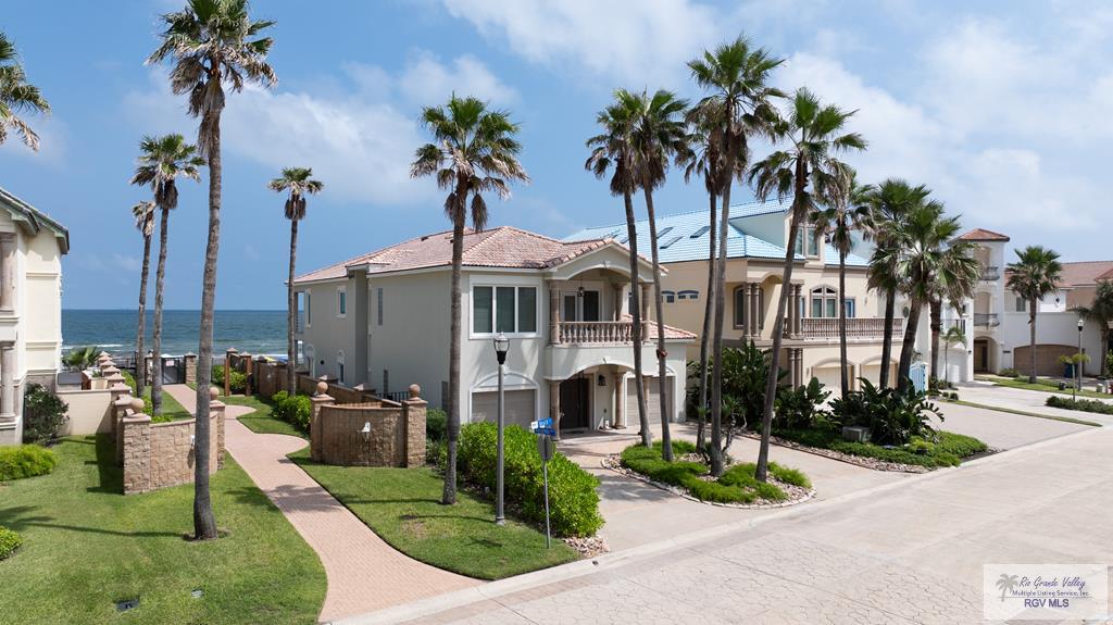 view of building exterior featuring a water view and a garage