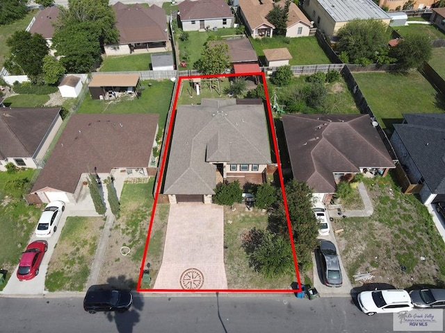 birds eye view of property with a residential view