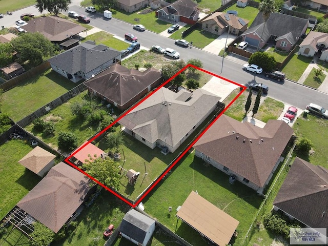 birds eye view of property with a residential view