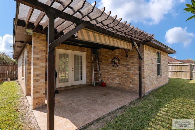 exterior space with a yard, fence, a patio, french doors, and a pergola