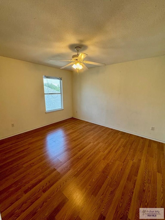 2100 Emory Ave Unit 291, Mcallen, TX 78504 - unfurnished room with wood finished floors, a textured ceiling, baseboards, and a ceiling fan