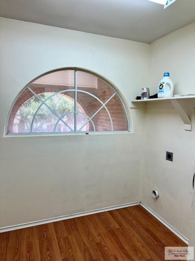 2100 Emory Ave Unit 291, Mcallen, TX 78504 - laundry area featuring wood finished floors, electric dryer hookup, and baseboards
