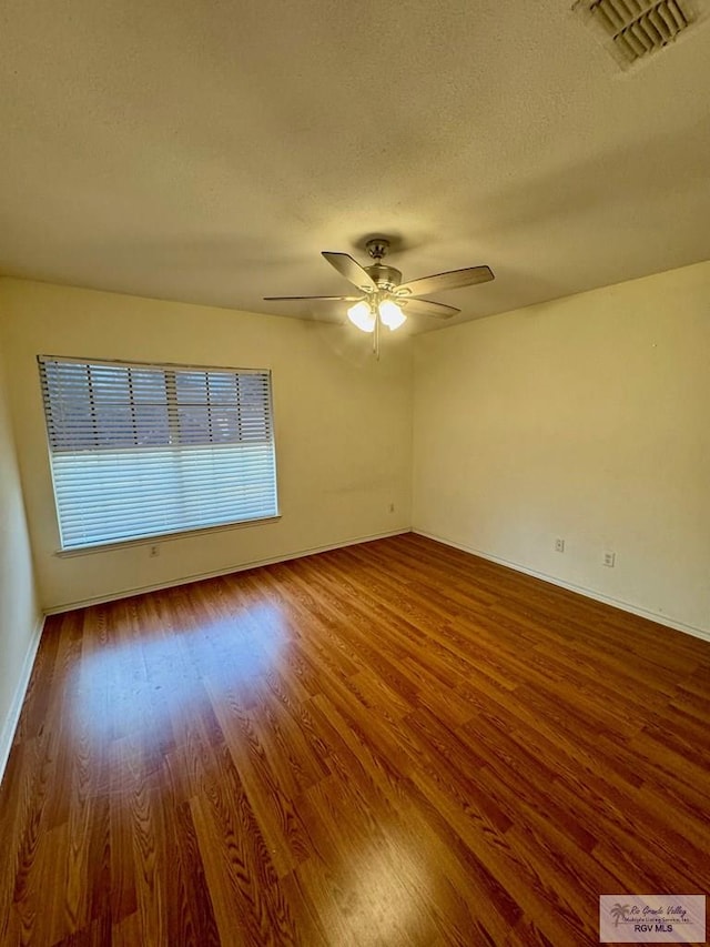 2100 Emory Ave Unit 291, Mcallen, TX 78504 - unfurnished room featuring wood finished floors, a textured ceiling, ceiling fan, and baseboards