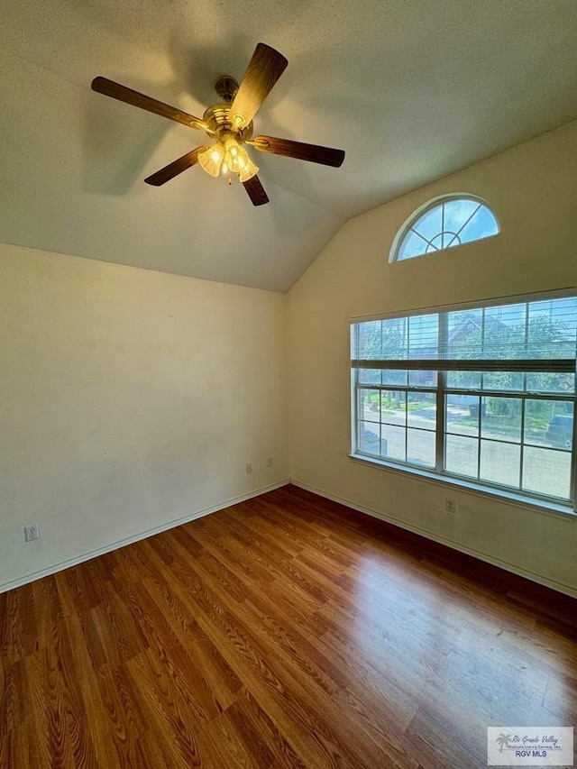 2100 Emory Ave Unit 291, Mcallen, TX 78504 - empty room featuring lofted ceiling, wood finished floors, a ceiling fan, and baseboards