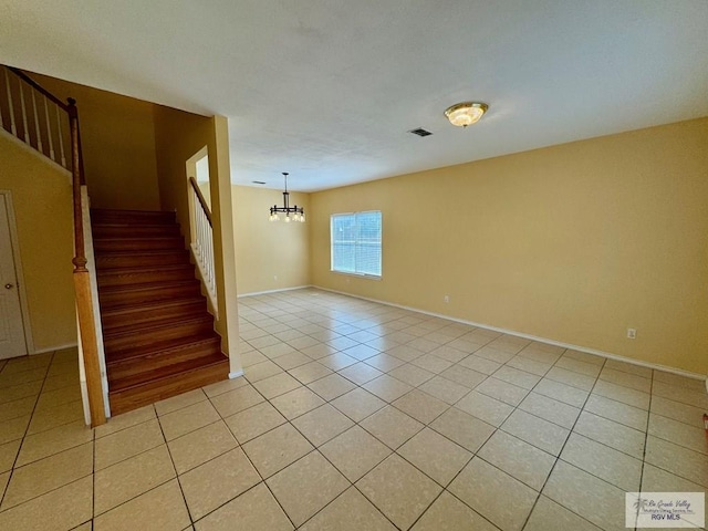 2100 Emory Ave Unit 291, Mcallen, TX 78504 - unfurnished room with stairway, light tile patterned flooring, a chandelier, and baseboards