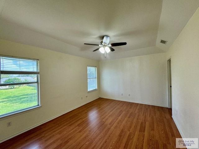 2100 Emory Ave Unit 291, Mcallen, TX 78504 - unfurnished room with wood finished floors, healthy amount of natural light, and baseboards