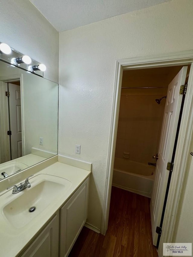 2100 Emory Ave Unit 291, Mcallen, TX 78504 - bathroom featuring wood finished floors, vanity, and bathtub / shower combination