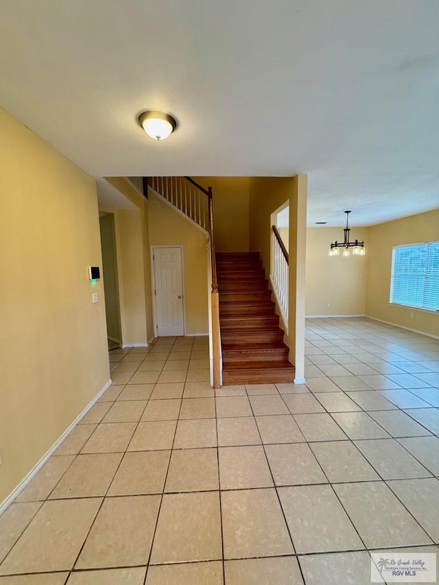 2100 Emory Ave Unit 291, Mcallen, TX 78504 - stairway with tile patterned floors, a chandelier, and baseboards