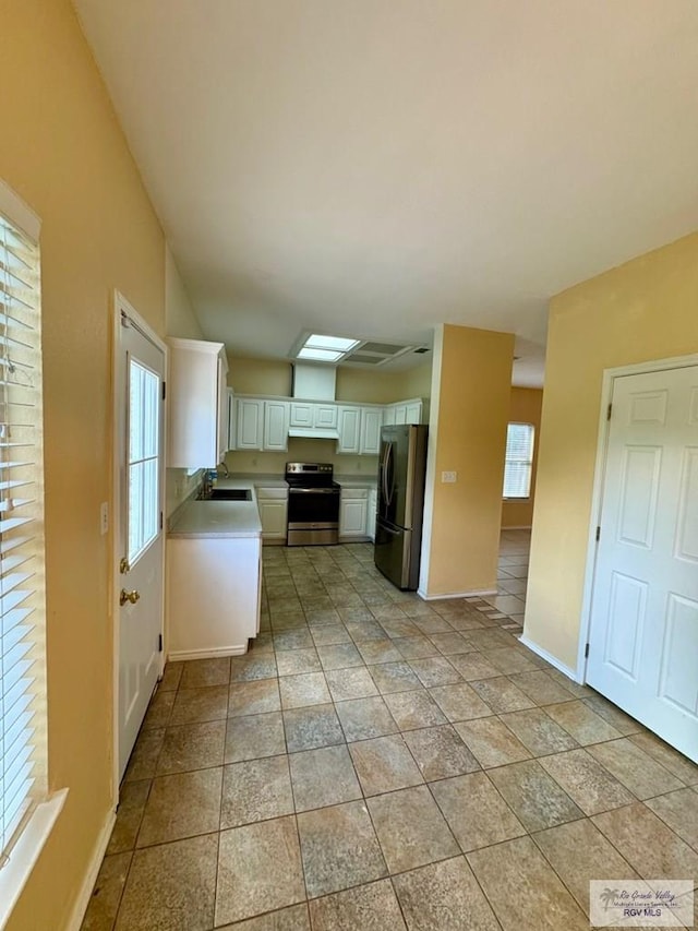 2100 Emory Ave Unit 291, Mcallen, TX 78504 - kitchen featuring appliances with stainless steel finishes, plenty of natural light, and baseboards