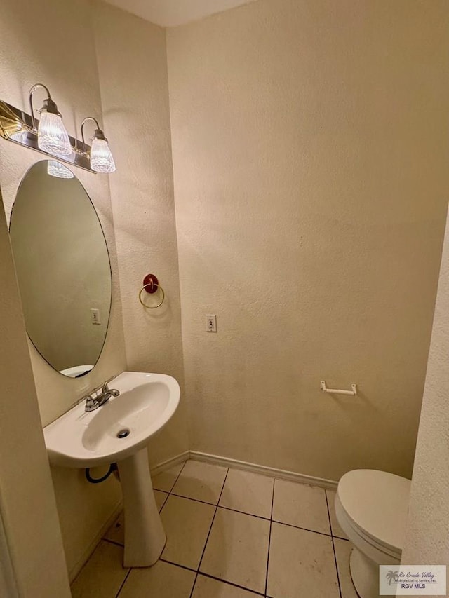 2100 Emory Ave Unit 291, Mcallen, TX 78504 - bathroom featuring toilet, tile patterned flooring, and baseboards