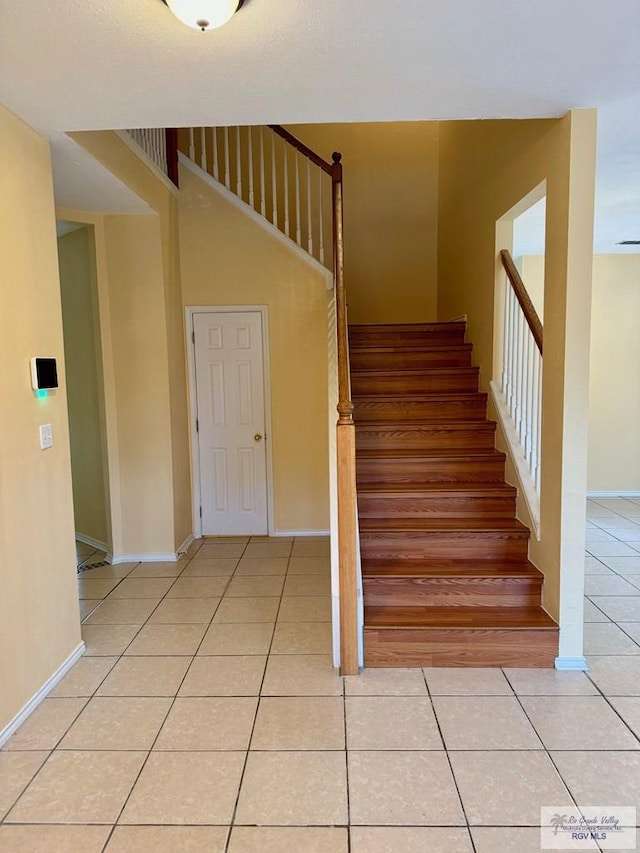 2100 Emory Ave Unit 291, Mcallen, TX 78504 - stairs featuring tile patterned floors and baseboards